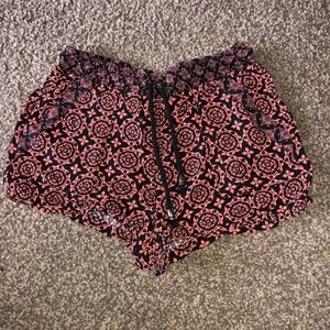 coral and black shorts